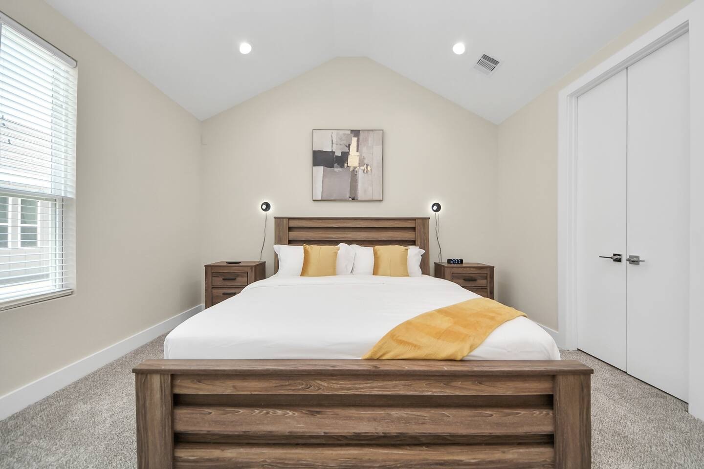 5935 Beall Street, Unit D Houston, TX 77091 - Photo 27 of 50 a bedroom with a bed and a chandelier