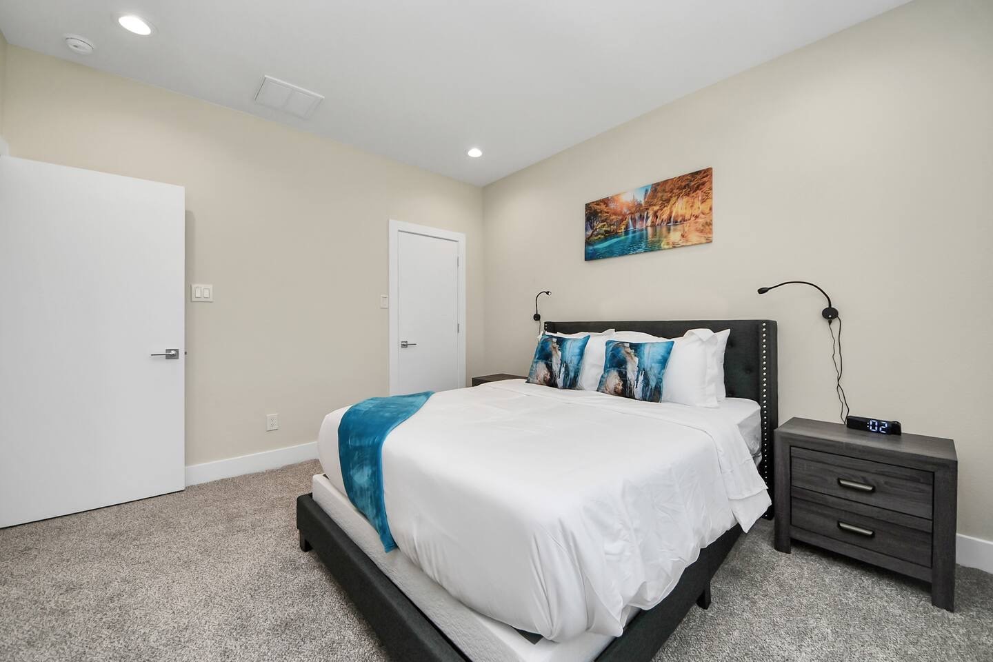 5935 Beall Street, Unit D Houston, TX 77091 - Photo 35 of 50 a bedroom with a bed and a night stand