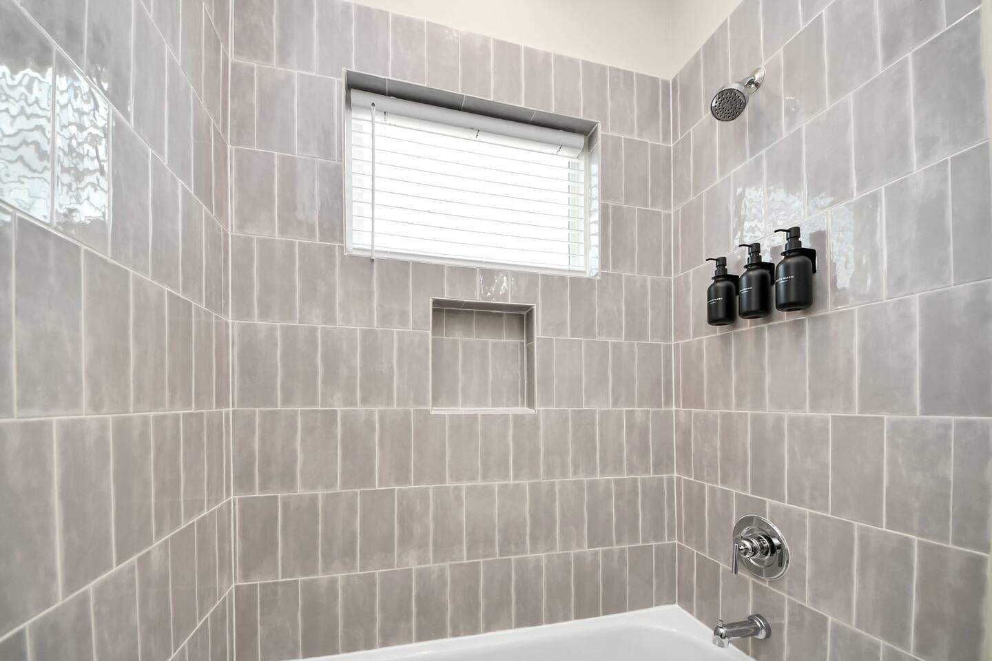 5935 Beall Street, Unit D Houston, TX 77091 - Photo 46 of 50 a bathroom with a window and a shower