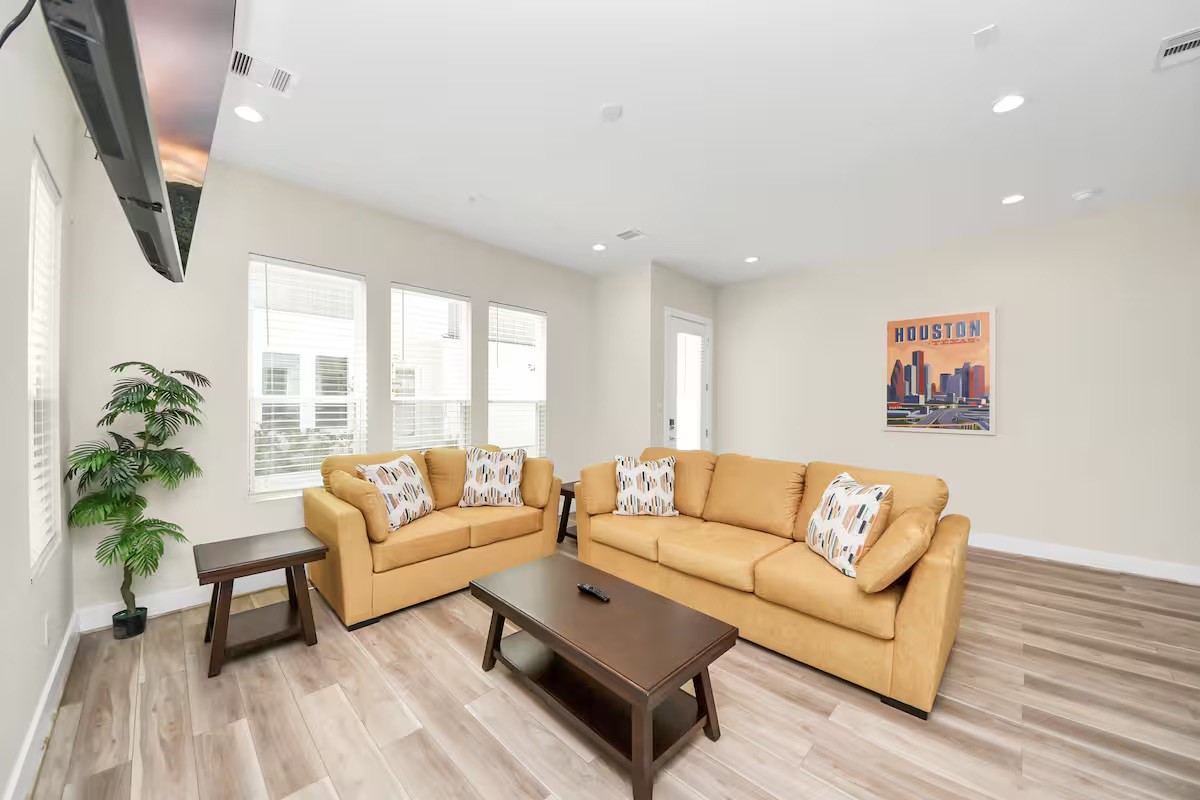 5935 Beall Street, Unit D Houston, TX 77091 - Photo 5 of 50 a living room with furniture and a large window