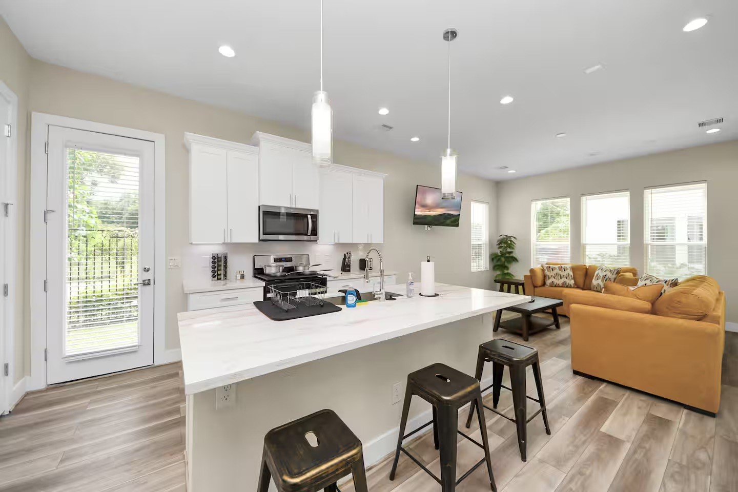 5935 Beall Street, Unit D Houston, TX 77091 - Photo 8 of 50 a kitchen with a table chairs stove and cabinets