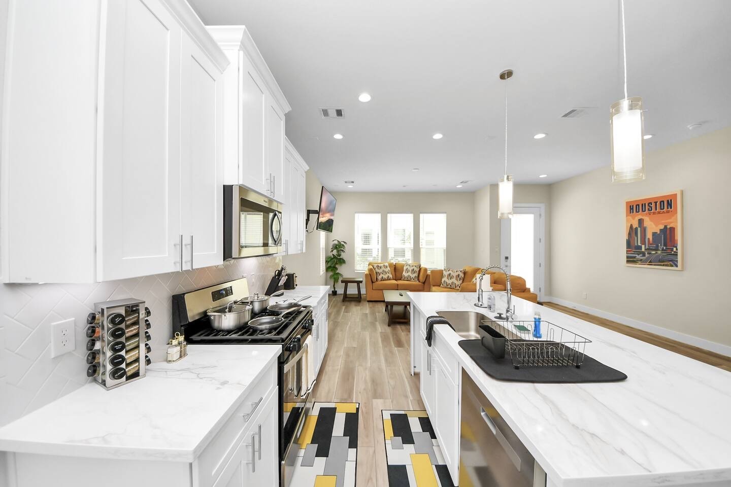 5935 Beall Street, Unit D Houston, TX 77091 - Photo 10 of 50 a large white kitchen with a large window
