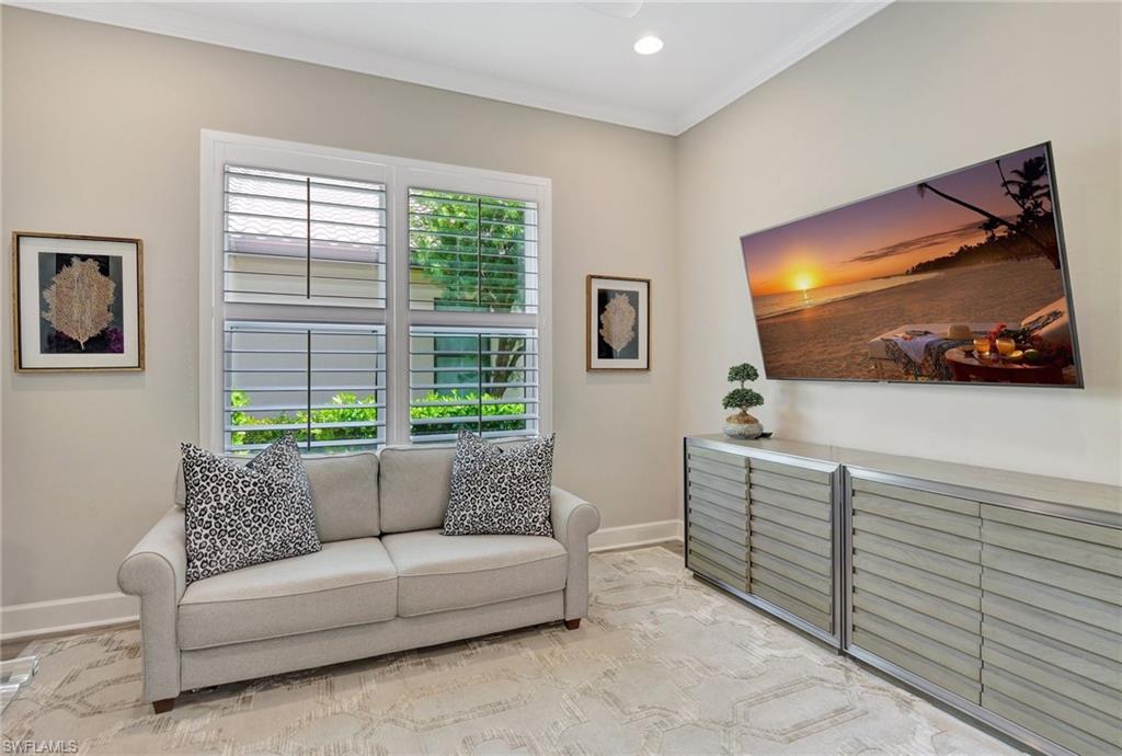 8558 Maggiore Court Naples, FL 34114 - Photo 14 of 50 a living room with furniture and a flat screen tv