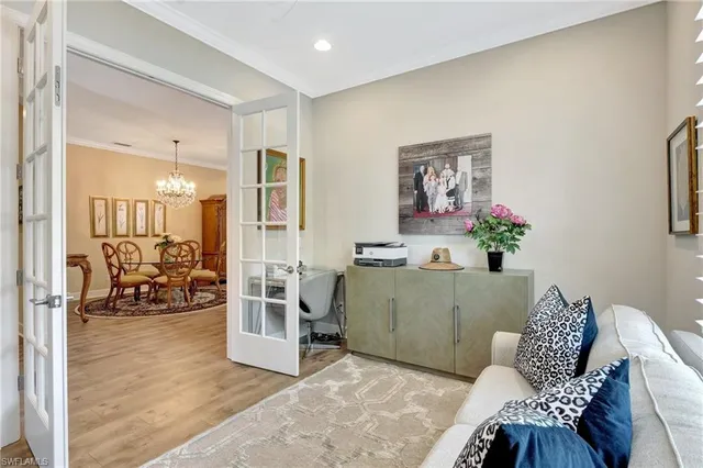 a kitchen with kitchen island granite countertop a white cabinets and chairs