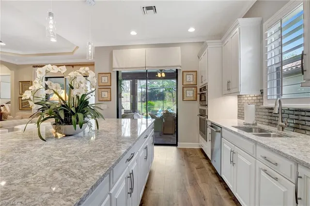 a spacious bedroom with a bed and a couch