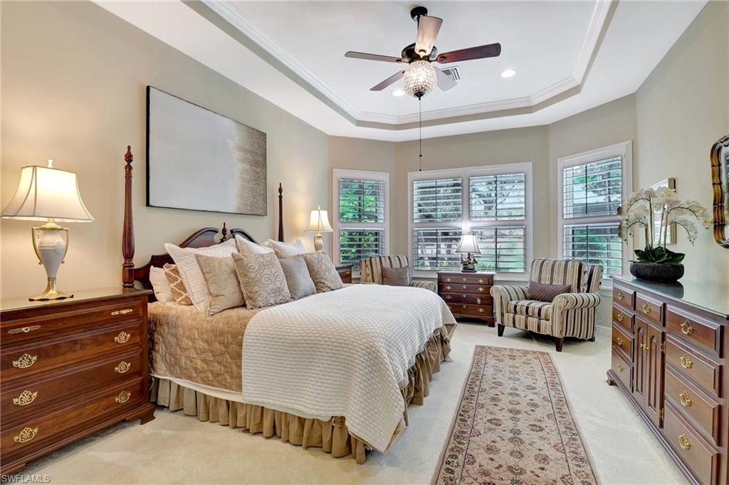 8558 Maggiore Court Naples, FL 34114 - Photo 21 of 50 a spacious bedroom with a bed and a couch