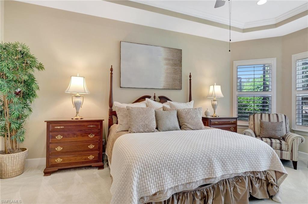 8558 Maggiore Court Naples, FL 34114 - Photo 23 of 50 a bed room with a bed and a lamp