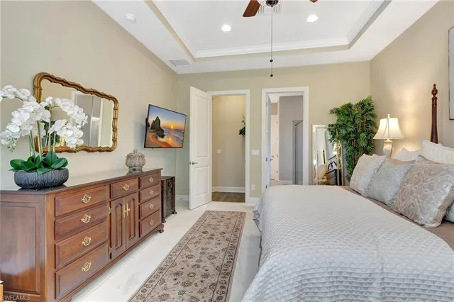 a bathroom with a granite countertop double vanity and a mirror