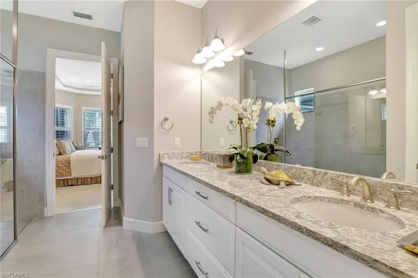 a bathroom with a shower and a sink