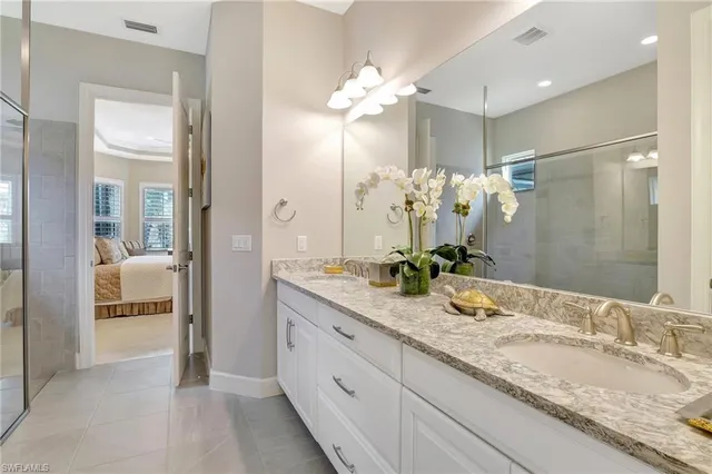 a bathroom with a shower and a sink