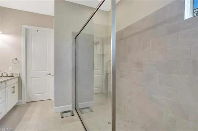 a bedroom with a bed and a potted plant