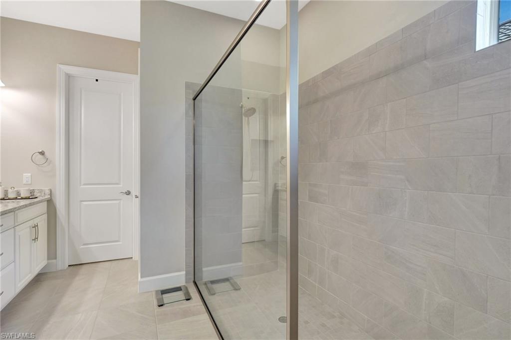 8558 Maggiore Court Naples, FL 34114 - Photo 27 of 50 a bathroom with a shower and a sink