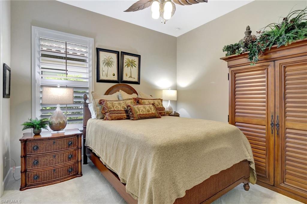 8558 Maggiore Court Naples, FL 34114 - Photo 28 of 50 a bedroom with a bed and a potted plant