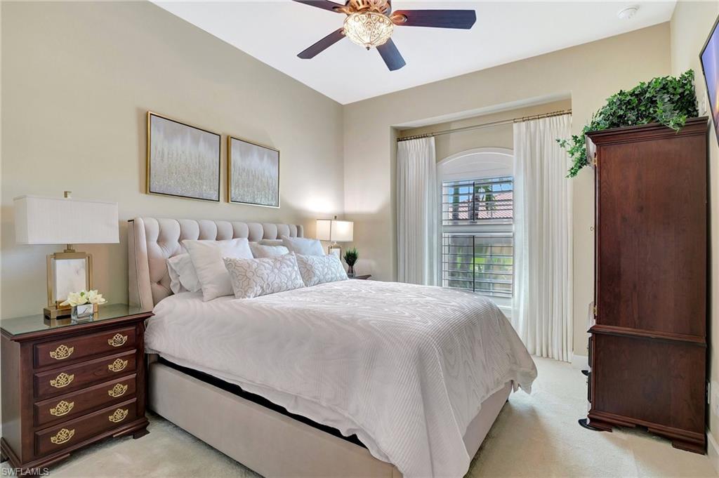 8558 Maggiore Court Naples, FL 34114 - Photo 32 of 50 a bedroom with a bed and a window