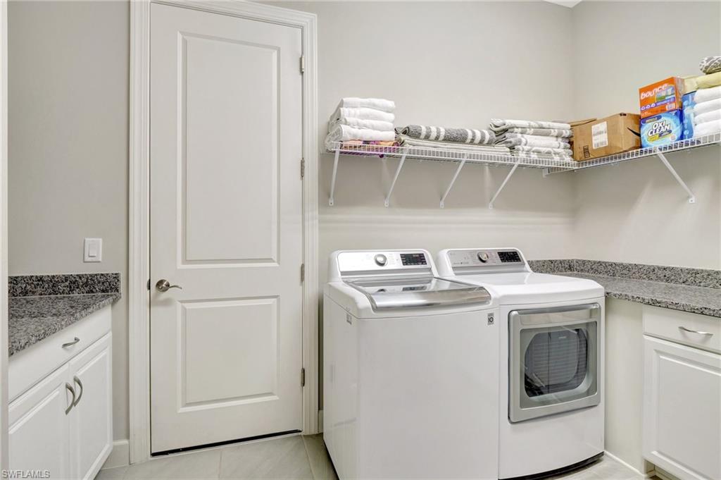 8558 Maggiore Court Naples, FL 34114 - Photo 35 of 50 a utility room with dryer and washer