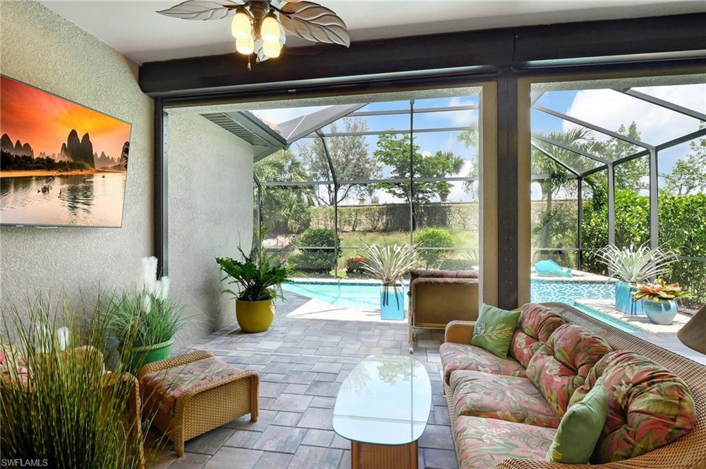 8558 Maggiore Court Naples, FL 34114 - Photo 36 of 50 a living room with furniture and a potted plant