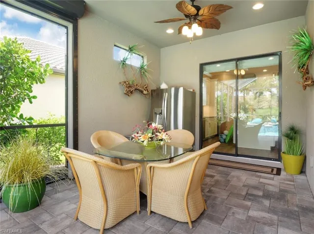 a view of a backyard with plants and a patio