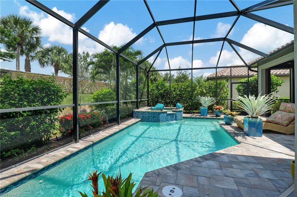 8558 Maggiore Court Naples, FL 34114 - Photo 39 of 50 a view of a backyard with plants and a patio