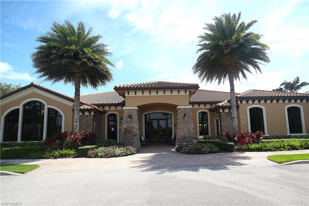 8558 Maggiore Court Naples, FL 34114 - Photo 42 of 50 a front view of a house with garden and garage