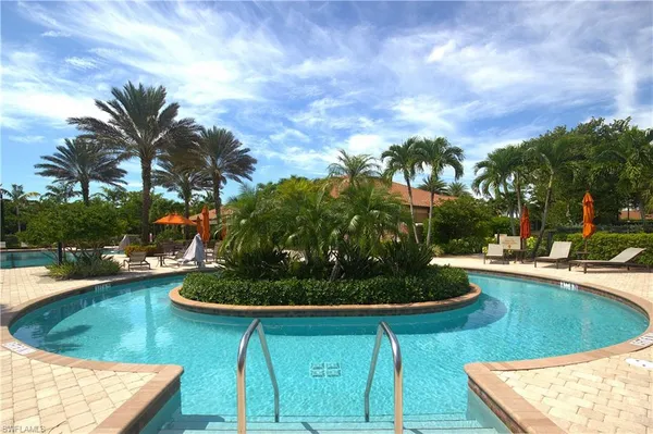 a kitchen with a sink a stove and cabinets