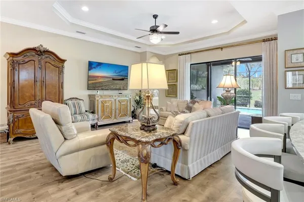 a living room with fireplace furniture and a flat screen tv