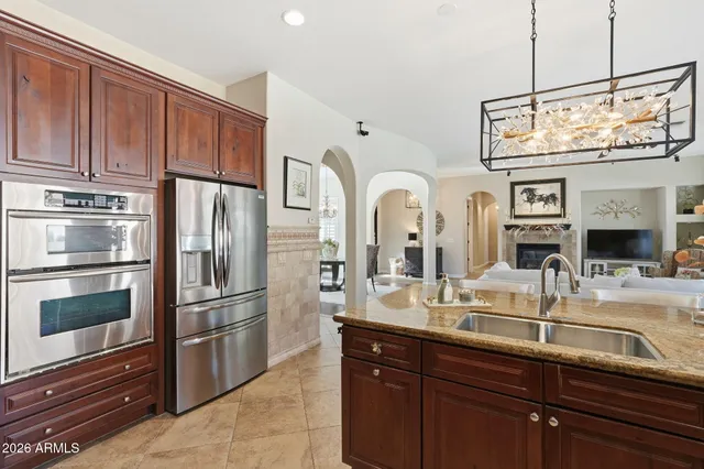 a en suite bathroom with a double vanity sink and a mirror