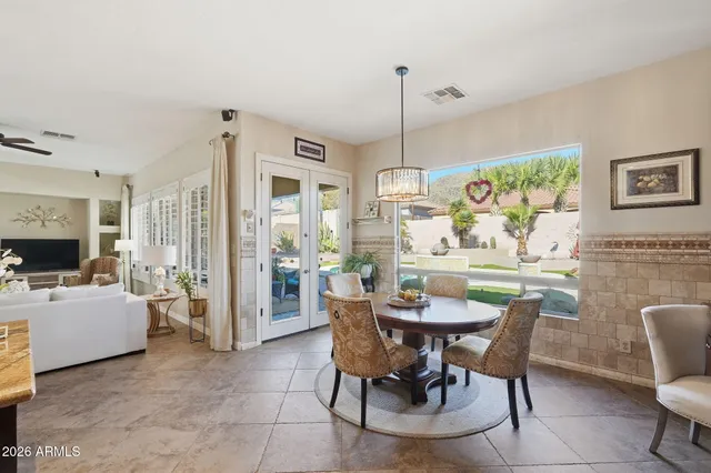 a bedroom with a bed and a table in it