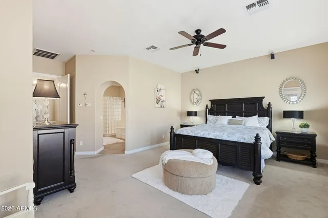 a living room with a dresser and a wooden floor