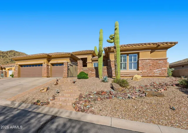 a living room with furniture large window and fireplace