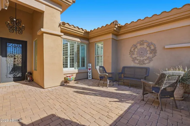 a living room with fireplace furniture and a flat screen tv