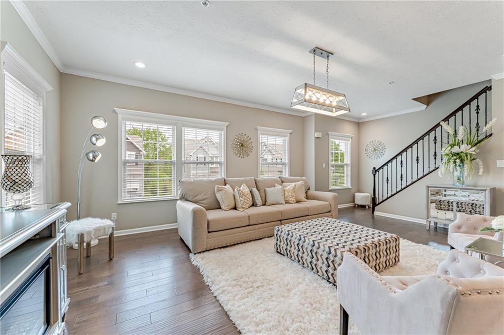 331 Trinity Way Wexford, PA 15090 - Photo 11 of 50 a living room with furniture and a chandelier