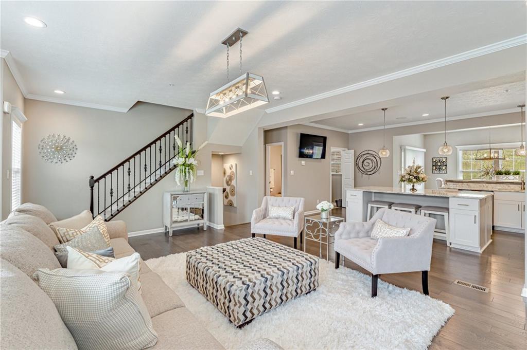 331 Trinity Way Wexford, PA 15090 - Photo 13 of 50 a living room with furniture and a dining table