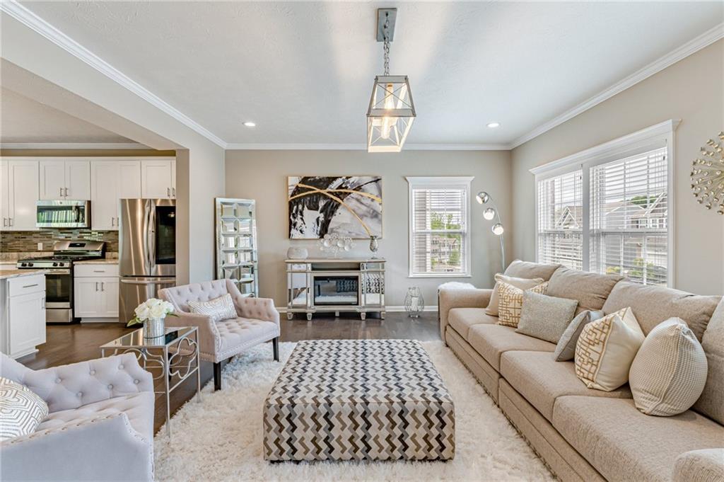 331 Trinity Way Wexford, PA 15090 - Photo 15 of 50 a living room with furniture fireplace and a large window