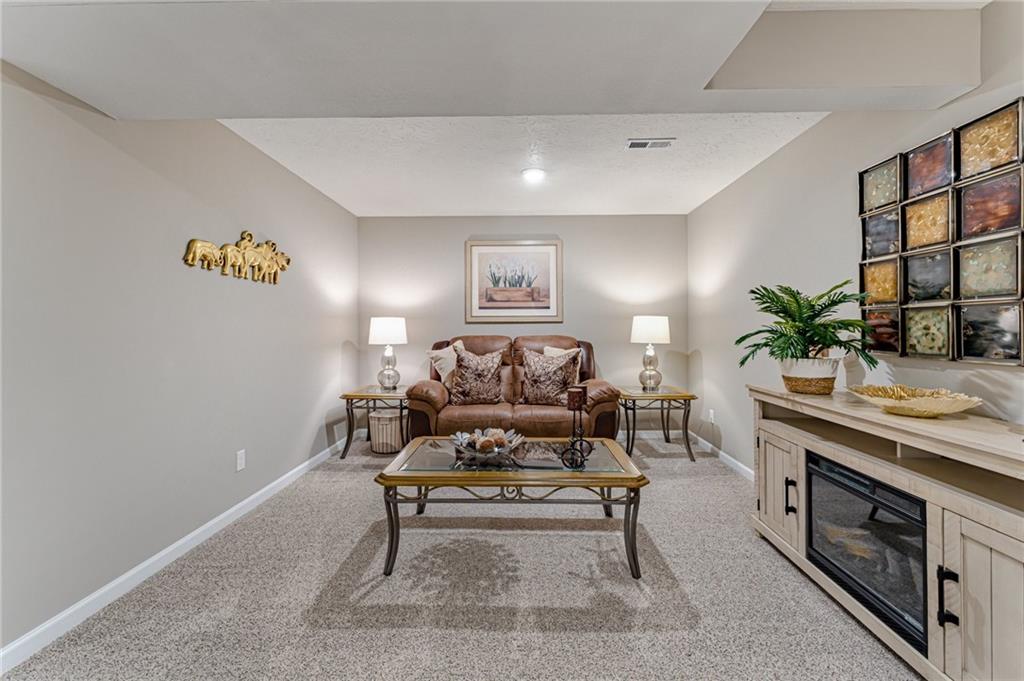 331 Trinity Way Wexford, PA 15090 - Photo 25 of 50 a living room with furniture and a potted plant