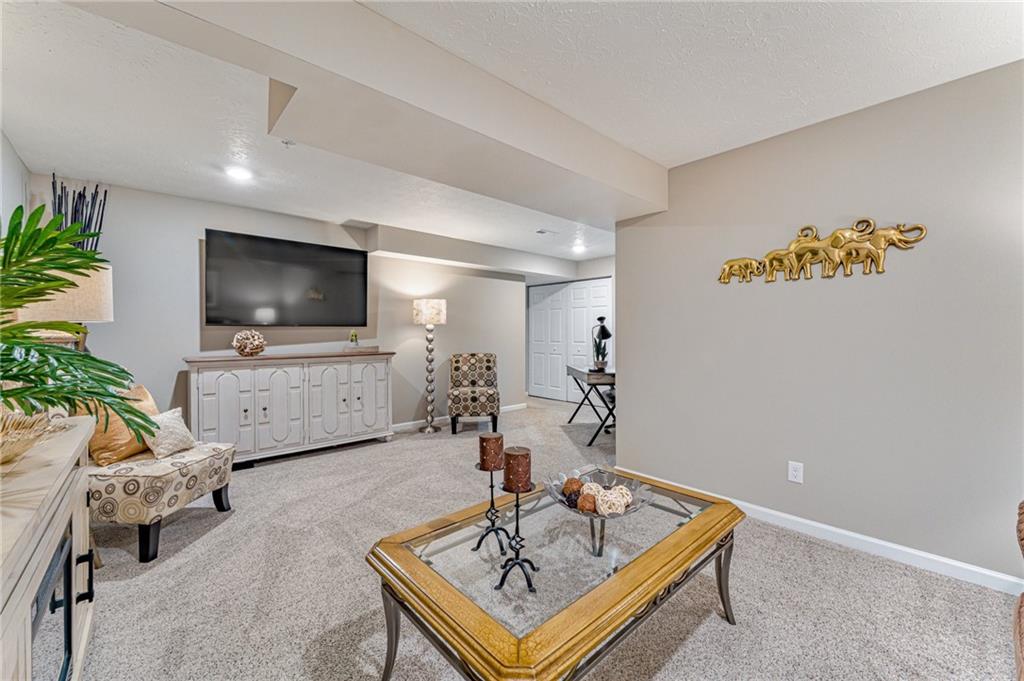 331 Trinity Way Wexford, PA 15090 - Photo 27 of 50 a living room with furniture and a flat screen tv