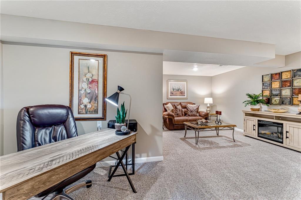 331 Trinity Way Wexford, PA 15090 - Photo 28 of 50 a living room with furniture and a fireplace