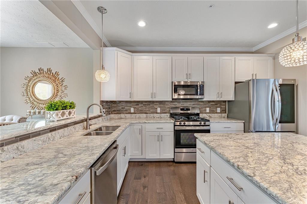 331 Trinity Way Wexford, PA 15090 - Photo 3 of 50 a kitchen with a sink stove and refrigerator