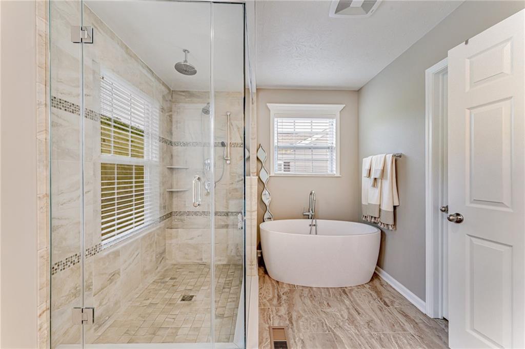 331 Trinity Way Wexford, PA 15090 - Photo 35 of 50 a bathroom with a tub shower and sink