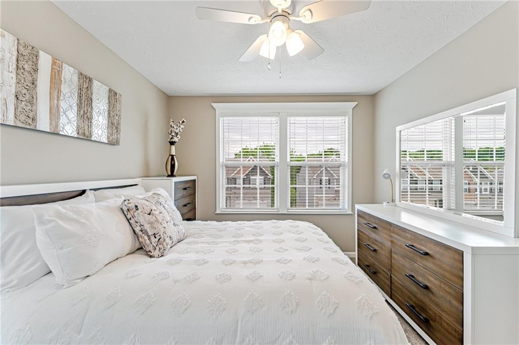 331 Trinity Way Wexford, PA 15090 - Photo 37 of 50 a bedroom with a large bed and a window