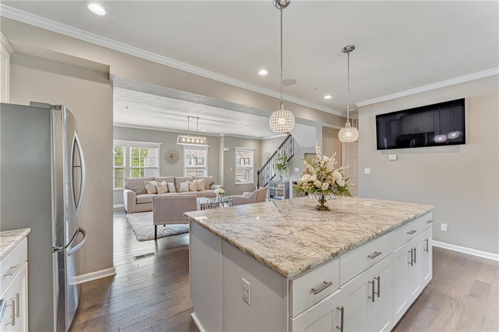 331 Trinity Way Wexford, PA 15090 - Photo 5 of 50 a view of living room and kitchen with a table chairs