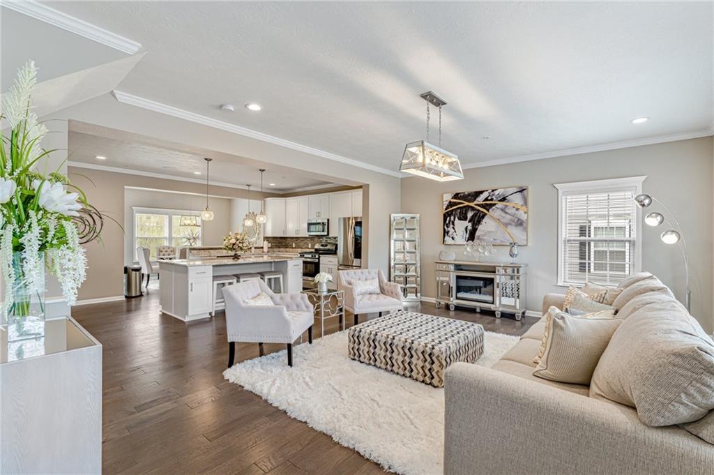 331 Trinity Way Wexford, PA 15090 - Photo 8 of 50 a living room with furniture and a fireplace