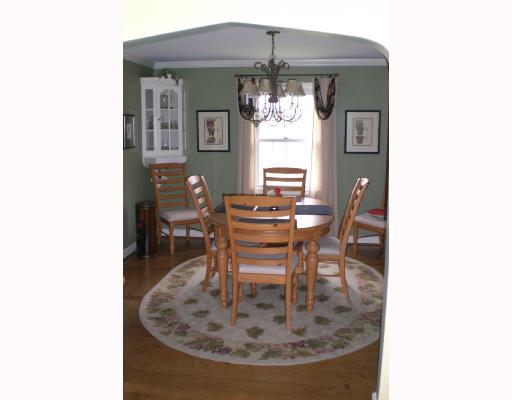 939 Freeport Road Natrona Heights, PA 15065 - Photo 3 of 8 Dining Room. Hardwood floors, new chandelier, built in china cabients flank window that overlooks back yard. Side porch access through french door.