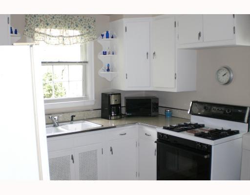 939 Freeport Road Natrona Heights, PA 15065 - Photo 4 of 8 Kitchen. Freshly painted kitchen, gas stove, refrigerator and disposal stay.