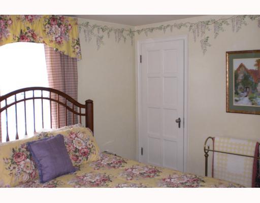 939 Freeport Road Natrona Heights, PA 15065 - Photo 6 of 8 Master Bedroom. Large Master has hand stenciled wisteria around ceiling, 8 paneled doors, a cozy dormer, 2 closets ( his & hers ) Cream wall to wall throughout upstairs.