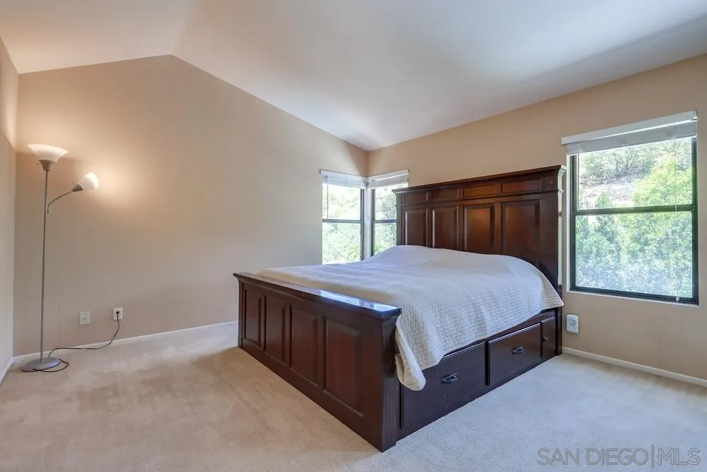 11746 Springside Road San Diego, CA 92128 - Photo 15 of 25 a spacious bedroom with a bed and window