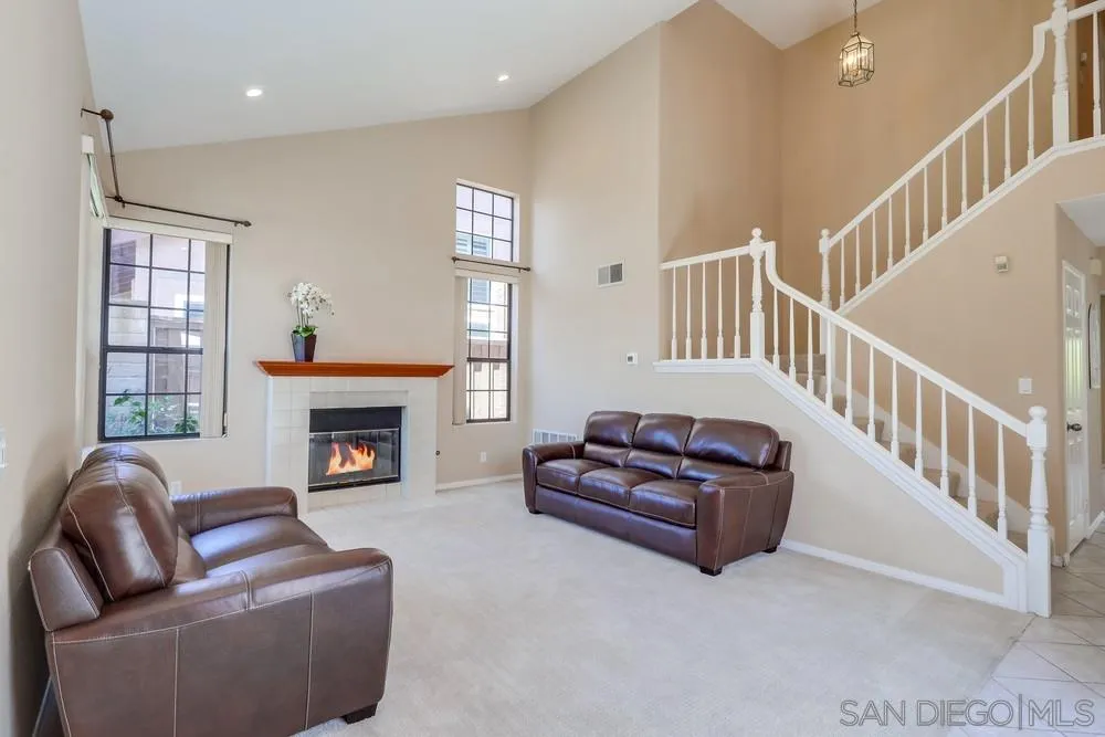 11746 Springside Road San Diego, CA 92128 - Photo 2 of 25 a living room with furniture fireplace and a window