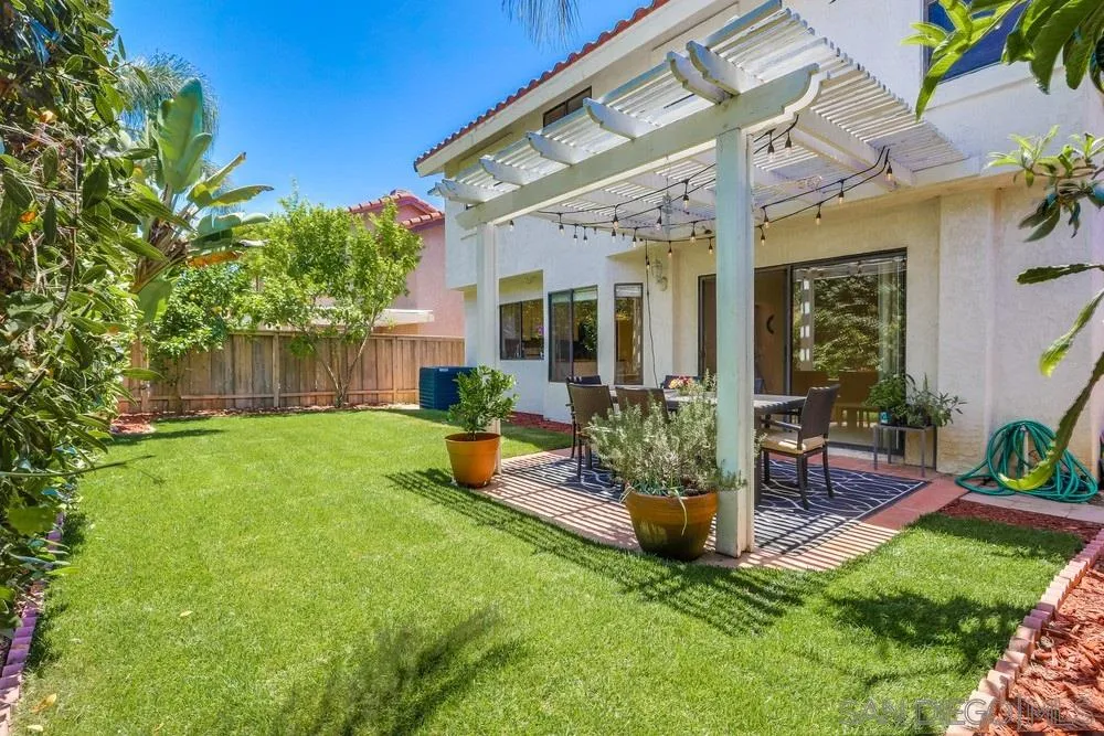 11746 Springside Road San Diego, CA 92128 - Photo 22 of 25 a view of a house with a backyard and porch