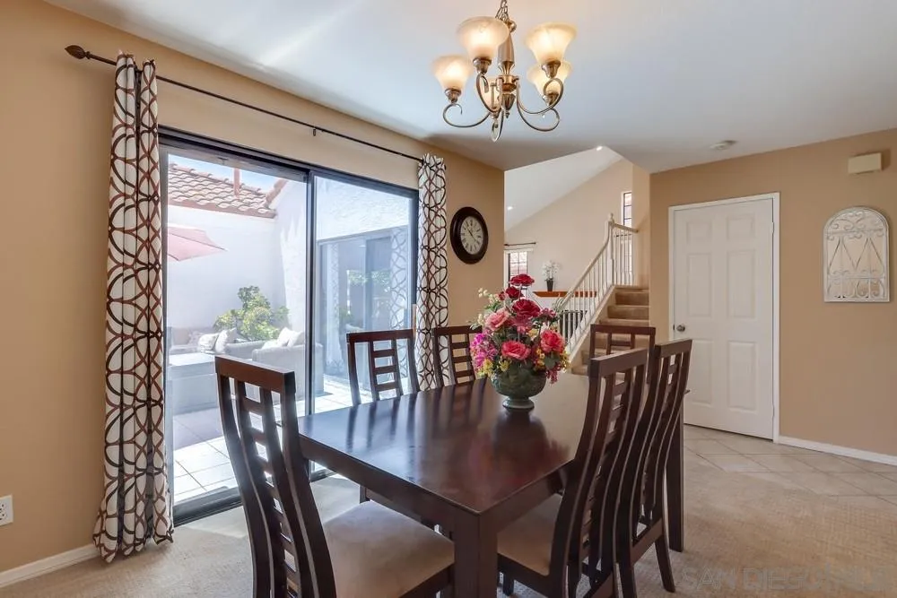 11746 Springside Road San Diego, CA 92128 - Photo 5 of 25 a view of a dining room with furniture and chandelier