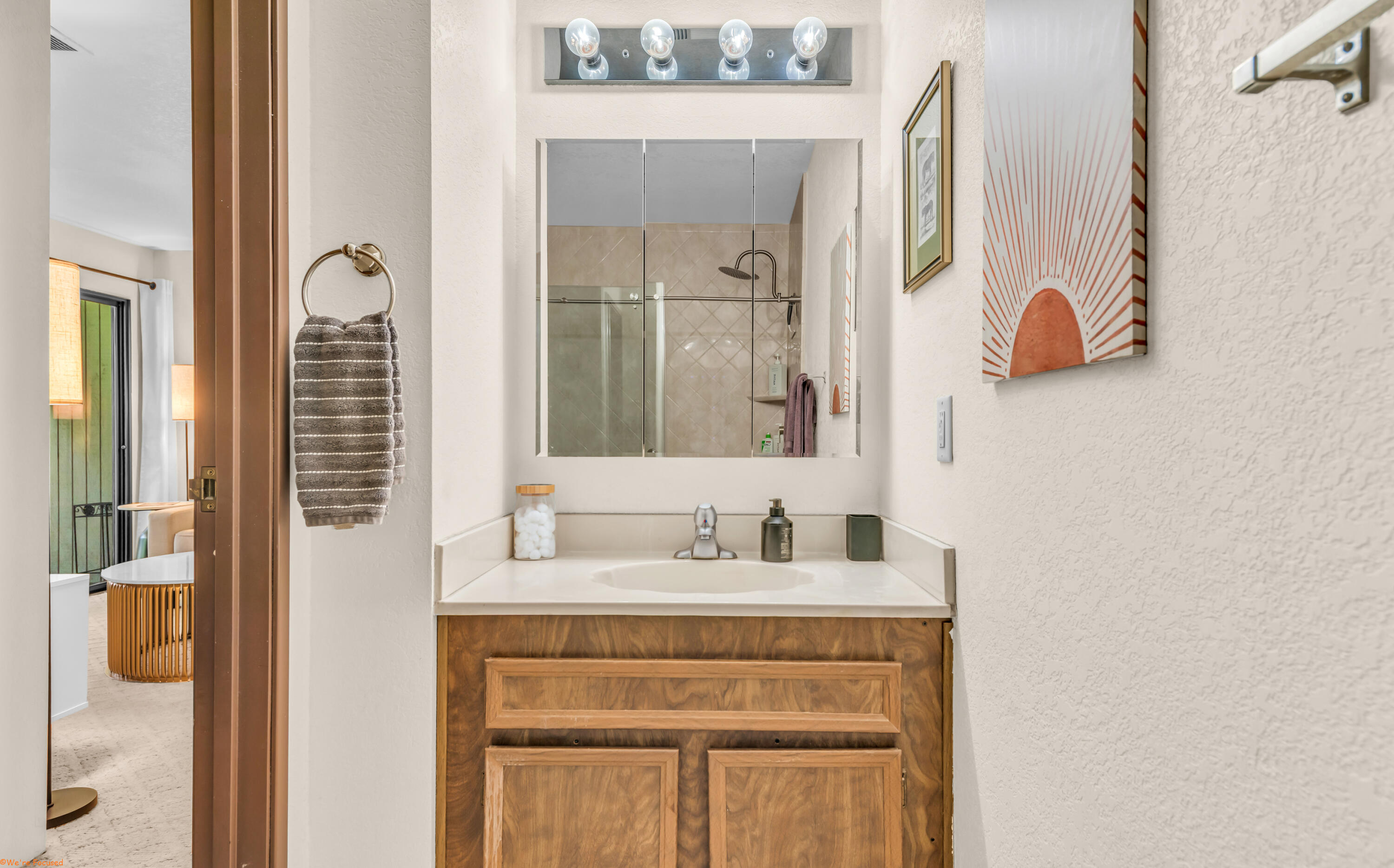 2800 Los Felices Circle North, Unit 107 Palm Springs, CA 92262 - Photo 12 of 18 a bathroom with a sink vanity and mirror