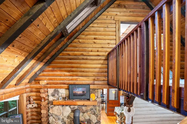 a bedroom with furniture and wooden floor